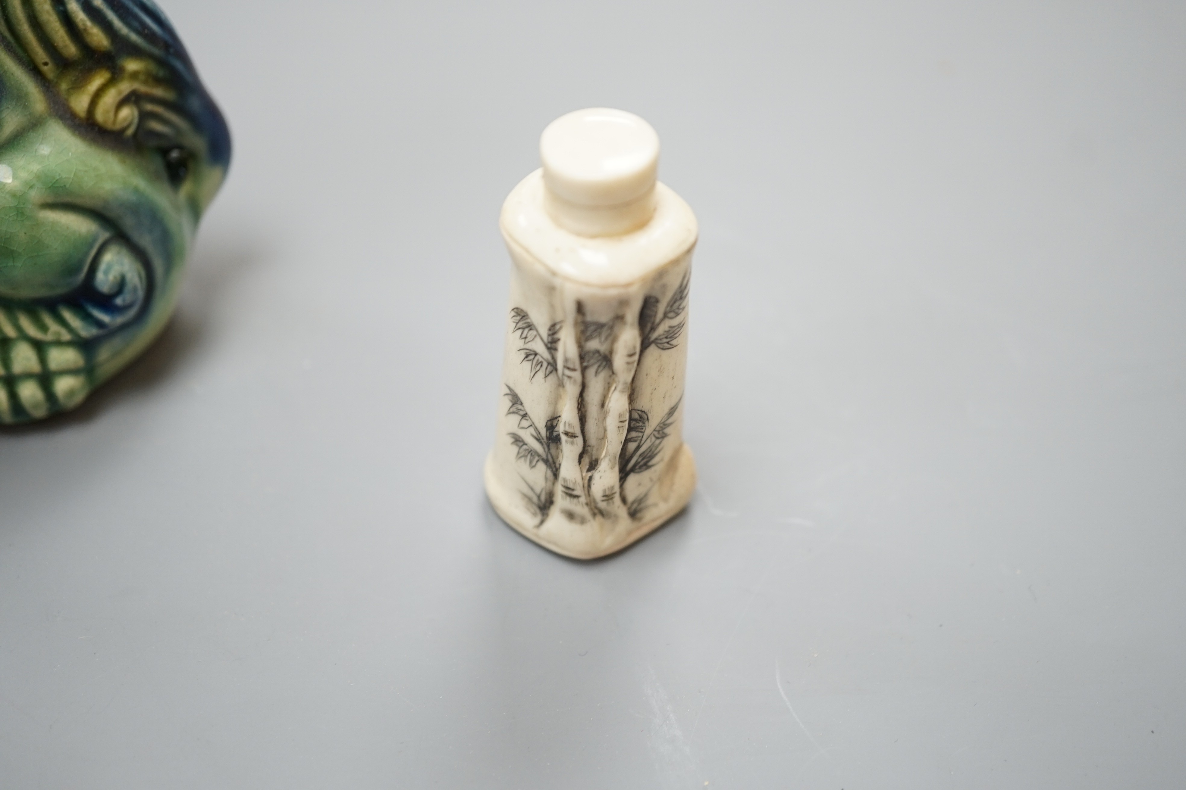 A Chinese carved bone snuff bottle, with cover, 6cm, together with Chinese ceramic wares (4), box 6.5 cms